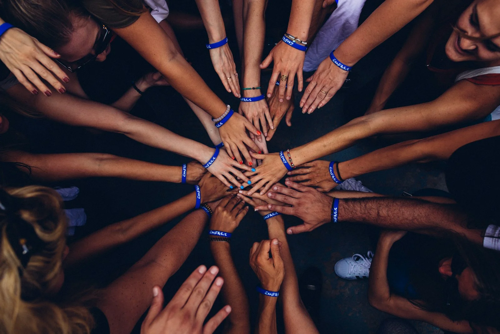 A group stacking their hands together